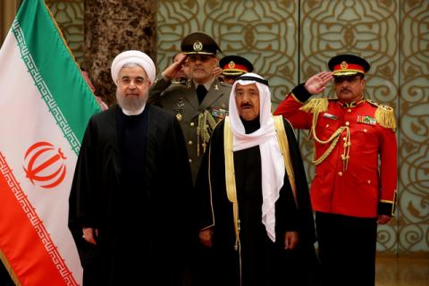 Iran's President Hassan Rouhani stands next to Emir of Kuwait Sheikh Sabah al-Ahmad al-Sabah during a welcoming ceremony in Kuwait City, Kuwait, February 15, 2017. PHOTO BY REUTERS/President.ir
