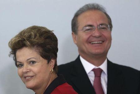 Brazil's President Dilma Rousseff smiles next Brazil's Senate President Senator Renan Calheiros during a ceremony to announce Measures of Consumer Protection at the Planalto Palace in Brasilia, March 15, 2013. PHOTO BY REUTERS/Ueslei Marcelino