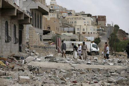People salvage belongings from the rubble of a house destroyed by a Saudi-led air strike in Yemen's capital Sanaa, September 7, 2015. PHOTO BY REUTERS/Khaled Abdullah