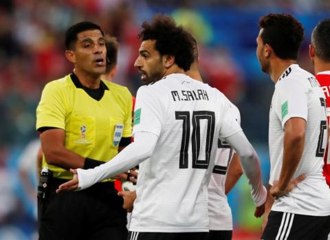 Egypt's Mohamed Salah with referee Enrique Caceres. PHOTO BY REUTERS/Lee Smith