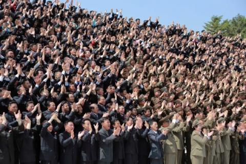 North Korean scientists and technicians, who developed missile "Hwasong-12" cheer North Korean leader Kim Jong Un in this undated photo released by North Korea's Korean Central News Agency (KCNA), May 20, 2017. PHOTO BY REUTERS/KCNA