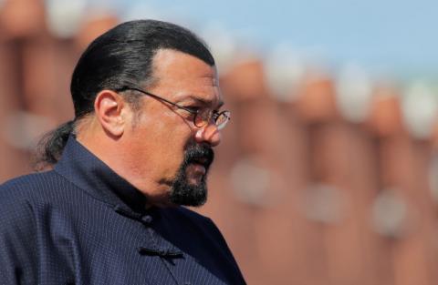 U.S. actor Steven Seagal watches the Victory Day parade, marking the 73rd anniversary of the victory over Nazi Germany in World War Two, at Red Square in Moscow, Russia, May 9, 2018. PHOTO BY REUTERS/Maxim Shemetov