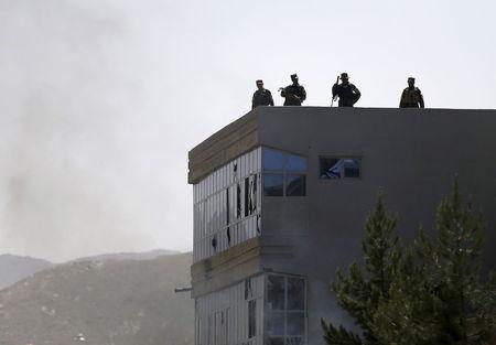 Afghan security forces keep watch on a roof of a building after a group of insurgents stormed a compound used by Afghanistan's intelligence agency in Kabul, Afghanistan, in this file photo taken on July 7, 2015. PHOTO BY REUTERS/Omar Sobhani