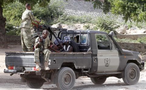 Somalia security forces transport blind-folded suspects detained on their pick-up truck after attackers from the militant group al Shabaab invaded the African Union's Halane base on the edge of the Mogadishu international airport compound in Somalia's capital Mogadishu, December 26, 2014. PHOTO BY REUTERS/Feisal Omar