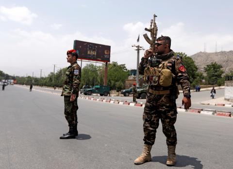 Afghan security forces keep watch at the site of a suicide attack in Kabul, Afghanistan, June 4, 2018. PHOTO BY REUTERS/Omar Sobhani
