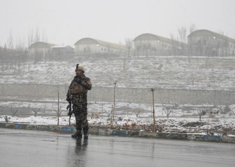 An Afghan security force member stands guard in front of the Marshal Fahim military academy in Kabul, Afghanistan, January 29, 2018. PHOTO BY REUTERS/Omar Sobhani
