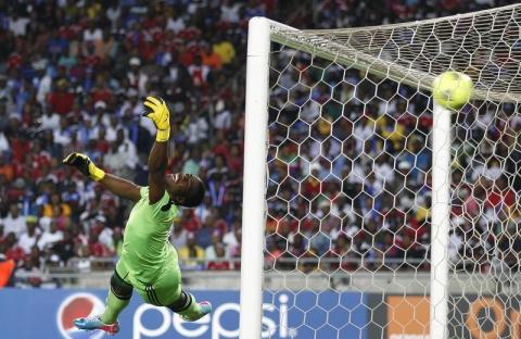 Goalkeeper Senzo Meyiwa of South Africa's Orlando Pirates is beaten by a goal made by Mohamed Aboutrika of Egypt's Al Ahli during the first leg of their African Champions League final soccer match at Orlando Stadium in Soweto, November 2, 2013. PHOTO BY REUTERS/Siphiwe Sibeko