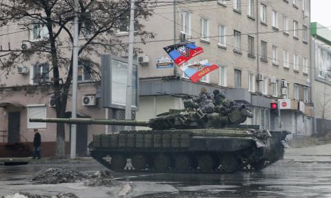 Pro-Russian separatists ride on a tank in Donetsk, eastern Ukraine, February 1, 2015. PHOTO BY REUTERS/Maxim Shemetov