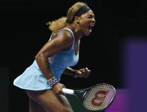 Serena Williams of the U.S. shouts as she wins a point against Caroline Wozniacki of Denmark during their WTA Finals singles semi-finals tennis match at the Singapore Indoor Stadium, October 25, 2014. PHOTO BY REUTERS/Edgar Su