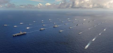 More than 40 ships and submarines representing 15 international partner nations travel in formation in the Pacific Ocean during the Rim of the Pacific (RIMPAC) 2014 exercise, July 25, 2014. PHOTO BY REUTERS/U.S. Navy