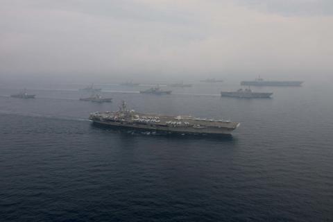 The U.S. Navy aircraft carriers USS Ronald Reagan (front) and USS Carl Vinson and (back R) sail with their strike groups and Japanese naval ships during training in the Sea of Japan, June 1, 2017. PHOTO BY REUTERS/U.S. Navy/Mass Communication Specialist 2nd Class Z.A. Landers