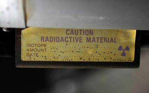 A sign indicating radioactive material is shown in Anaheim, California, March 17, 2011. PHOTO BY REUTERS/Lucy Nicholson