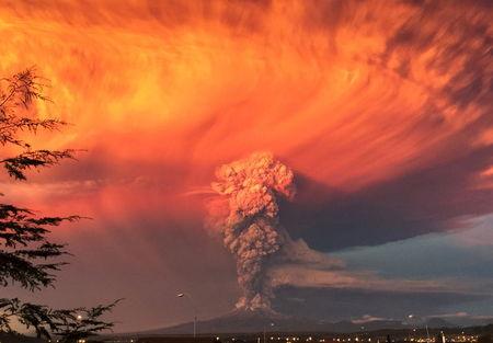 Smoke and ash rise from the Calbuco volcano as seen from the city of Puerto Montt, Chile, April 22, 2015. PHOTO BY REUTERS/Rafael Arenas