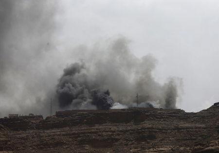 Smoke billows from the site of a Saudi-led air strike in Yemen's capital Sanaa, July 2, 2015. PHOTO BY REUTERS/Khaled Abdullah