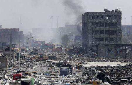 Smoke rise from the site of the explosions at the Binhai new district, Tianjin, August 13, 2015. PHOTO BY REUTERS/Jason Lee