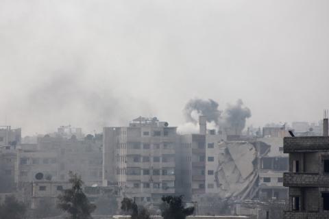 Smoke rises after what activists said was an airstrike by forces loyal to Syria's President Bashar al-Assad in eastern Al-Ghouta, near Damascus, January 25, 2015. PHOTO BY REUTERS/Diaa Al-Din