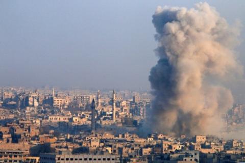 Smoke rises as seen from a governement-held area of Aleppo, Syria, December 12, 2016. PHOTO BY REUTERS/Omar Sanadiki