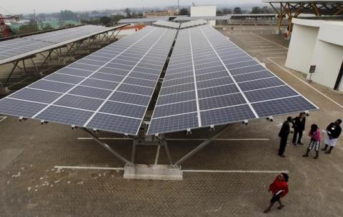Delegates are pictured during the launch event of a solar carport at the Garden City shopping mall in Kenya's capital Nairobi, September 15, 2015. PHOTO BY REUTERS/Thomas Mukoya