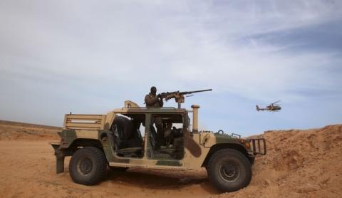 A Tunisian soldier holds his position during an exercise along the frontier with Libya in Sabkeht Alyun, Tunisia, February 6, 2016. PHOTO BY REUTERS/Zoubeir Souissi