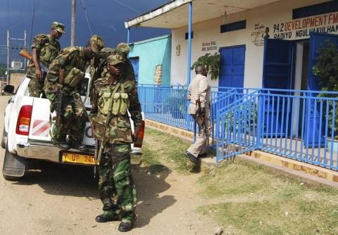 Uganda People's Defence Forces soldiers participate in a security patrol in Western, Uganda, July 6, 2014. PHOTO BY REUTERS/Stringer