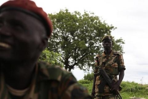 Sudan People's Liberation Army (SPLA) soldiers chat before the start of celebrations on the 31st anniversary of the SPLA in Juba, May 16, 2014. PHOTO BY REUTERS/Andreea Campeanu