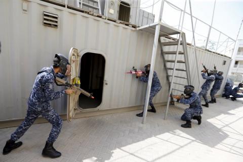 Bahraini Royal Navy special task force show their skills during a media demonstration for the International Mine Countermeasures Exercise (IMCMEX) at the Bahrain Naval Support Unit, Fifth Fleet Command centre in Manama, Bahrain, April 9, 2016. PHOTO BY REUTERS/Hamad I Mohammed