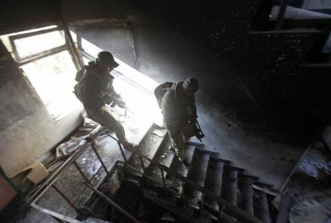 Members of the Iraqi rapid response forces inspect a hospital damaged by clashes during a battle between Iraqi forces and Islamic State militants in the Wahda district of eastern Mosul, Iraq. PHOTO BY REUTERS/Alaa Al-Marjani
