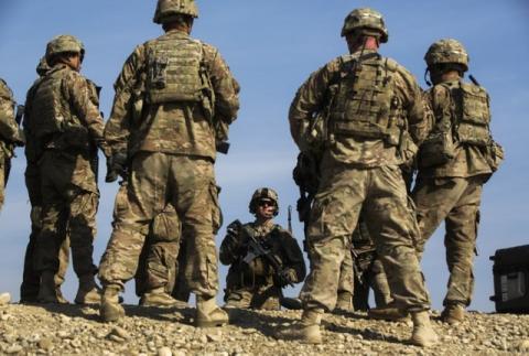 U.S. soldiers from Dragon Troop of the 3rd Cavalry Regiment discuss their mission during their first training exercise of the new year near operating base Gamberi in the Laghman province of Afghanistan, January 1, 2015. PHOTO BY REUTERS/Lucas Jackson