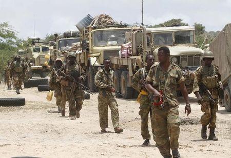 Somalia's army soldiers make their way to the town of Barawe during the second phase of Operation Indian Ocean, October 5, 2014. PHOTO BY REUTERS/Feisal Omar