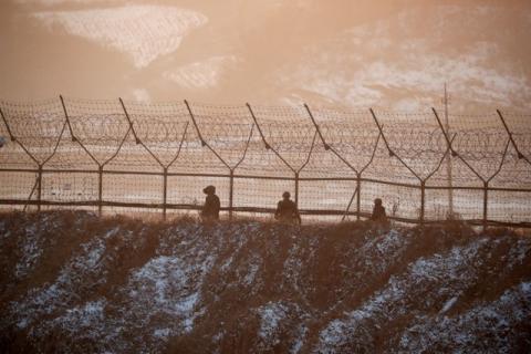 South Korean soldiers patrol along a barbed-wire fence near the demilitarized zone separating the two Koreas, in Paju, South Korea, December 21, 2017. PHOTO BY REUTERS/Kim Hong-Ji