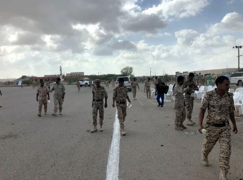 Soldiers inspect the scene of a Houthi drone attack at Yemeni government military parade in al-Anad air base, Lahaj province, Yemen, January 10, 2019. PHOTO BY REUTERS/Stringer