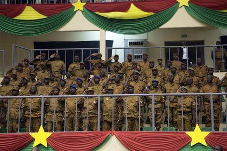 Soldiers salute during the swearing-in ceremony of Burkina Faso's President Michel Kafondo in Ouagadougou, November 21, 2014. PHOTO BY REUTERS/Joe Penney