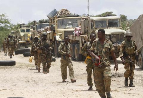 Somalia's army soldiers make their way to the town of Barawe during the second phase of Operation Indian Ocean