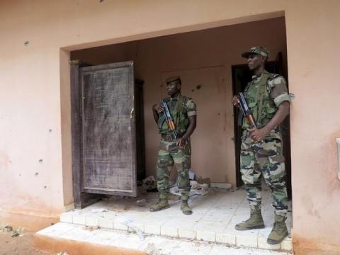 Malian soldiers stand guard in a file photo. PHOTO BY REUTERS/Adama Diarra