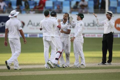 South Africa's JP Duminy (C) and teammates celebrate their victory over Pakistan during the second test cricket match in Dubai