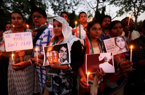 Supporters of India's main opposition Congress party participate in a candle light vigil as they protest against the rape of an eight-year-old girl in Kathua near Jammu, and a teenager in Unnao, Uttar Pradesh state, in Ahmedabad, India, April 13, 2018. PHOTO BY REUTERS/Amit Dave