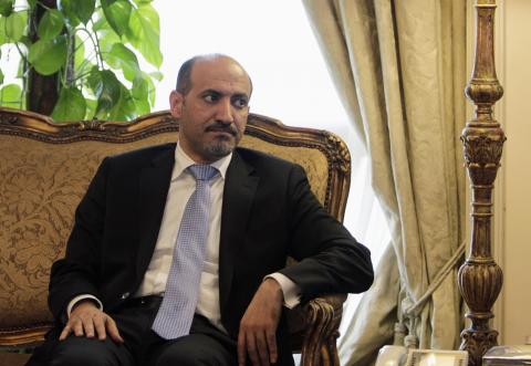 President of the Syrian National Coalition Ahmad Al-Jarba looks on during his meeting with Egypt's Foreign Minister Nabil Fahmy (not pictured) in Cairo