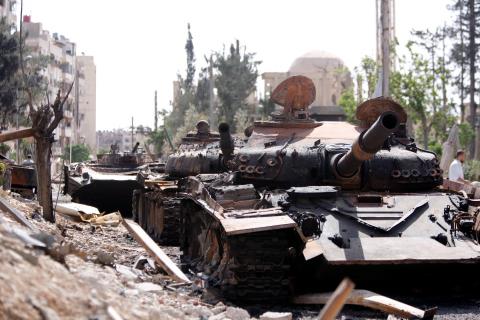 A damaged military vehicle is seen at the city of Douma in Damascus, Syria, April 20, 2018. PHOTO BY REUTERS/Omar Sanadiki