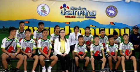 The 12 boys and their soccer coach who were rescued from a flooded cave arrive for a news conference in the northern province of Chiang Rai, Thailand, July 18, 2018. PHOTO BY REUTERS/Soe Zeya Tun