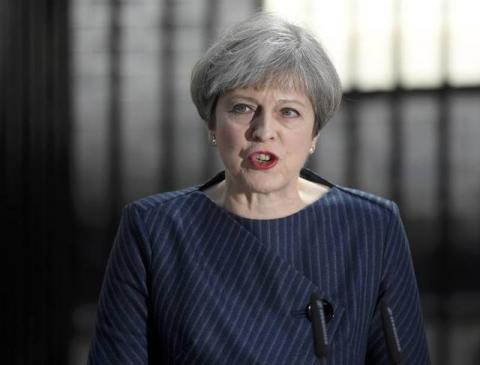 Britain's Prime Minister Theresa May speaks to the media outside 10 Downing Street. PHOTO BY REUTERS/Toby Melville