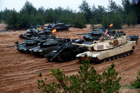 U.S., German, Spanish and Polish troops of the NATO enhanced Forward Presence battle goups with their tanks get ready for the Iron Tomahawk exercise in Adazi, Latvia, October 23, 2018. PHOTO BY REUTERS/Ints Kalnins