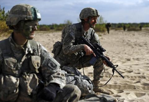 Troops from the U.S. Army's 173rd Infantry Brigade Combat Team participate at the NATO-led exercise "Orzel Alert" held together with Canada's 3rd Battalion and Princess Patricia's Light Infantry, and Poland's 6th Airborne Brigade in Bledowska Desert in Chechlo, near Olkusz, south Poland, May 5, 2014. PHOTO BY REUTERS/Kacper Pempel