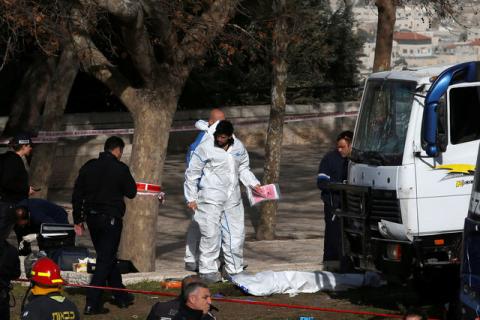 Israeli security and rescue forces work at the scene of a truck ramming incident in Jerusalem, January 8, 2017. PHOTO BY REUTERS/Ronen Zvulun