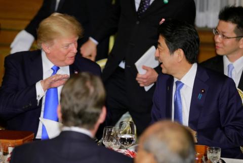 U.S. President Donald Trump talks with Japanese Prime Minister Shinzo Abe at the opening of a welcome dinner hosted by Abe at Akasaka Palace in Tokyo, Japan, November 6, 2017. REUTERS/Shizuo Kambayashi