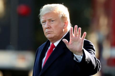 U.S. President Donald Trump waves prior to departing on a trip to Wisconsin from the White House in Washington, U.S., October 24, 2018. PHOTO BY REUTERS/Cathal McNaughton
