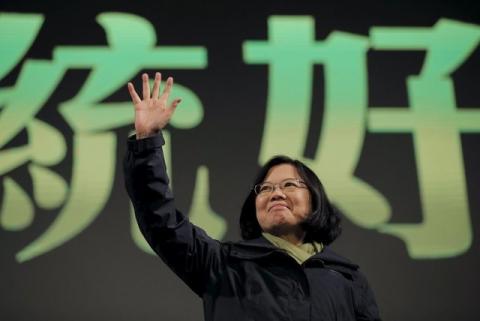Democratic Progressive Party (DPP) Chairperson and presidential candidate Tsai Ing-wen waves to her supporters after her election victory at party headquarters in Taipei, Taiwan, January 16, 2016. PHOTO BY REUTERS/Damir Sagolj