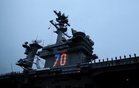 Sailors man the rails as the USS Carl Vinson aircraft carrier departs on deployment from Naval Station North Island in Coronado, California, U.S., January 5, 2017. PHOTO BY REUTERS/Mike Blake