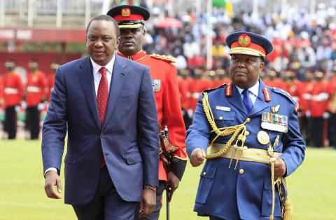 Kenya's President Uhuru Kenyatta (L) walks back after inspecting a military parade during a national celebration to mark Kenya's Jamhuri Day (Independence Day) at the Nyayo Stadium in Nairobi, December 12, 2014. PHOTO BY REUTERS/Noor Khamis