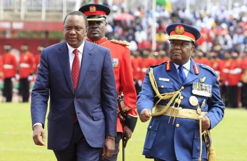 Kenya's President Uhuru Kenyatta (L) walks back after inspecting a military parade during a national celebration to mark Kenya's Jamhuri Day (Independence Day) at the Nyayo Stadium in Nairobi, December 12, 2014. PHOTO BY REUTERS/Noor Khamis