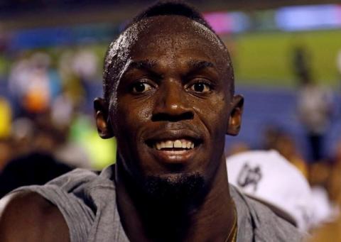 Jamaica's Olympic champion Usain Bolt smiles after winning his final 100 meters sprint at the 2nd Racers Grand Prix at the National Stadium in Kingston, Jamaica, June 10, 2017. PHOTO BY REUTERS/Gilbert Bellamy